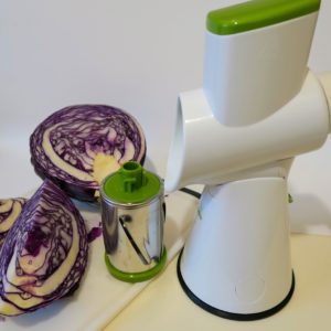 Starfrit drum slicer with a large red cabbage cut into quarters