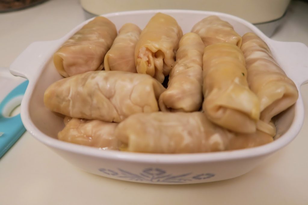 A casserole dish filled with finished sour cabbage rolls
