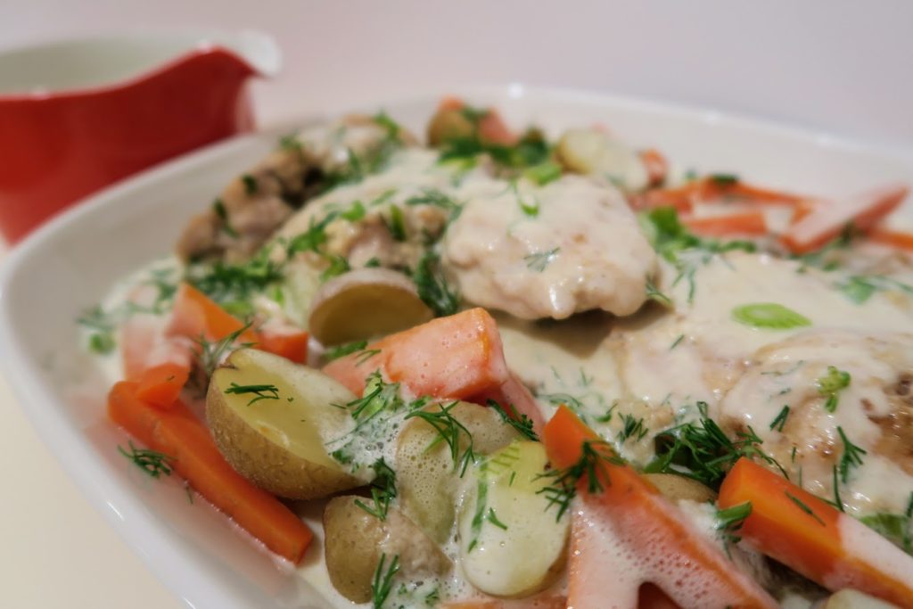 Sunday chicken dinner with carrots dill and extra cream sauce