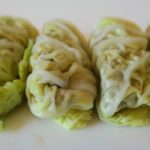 Six very neat uncooked little cabbage rolls