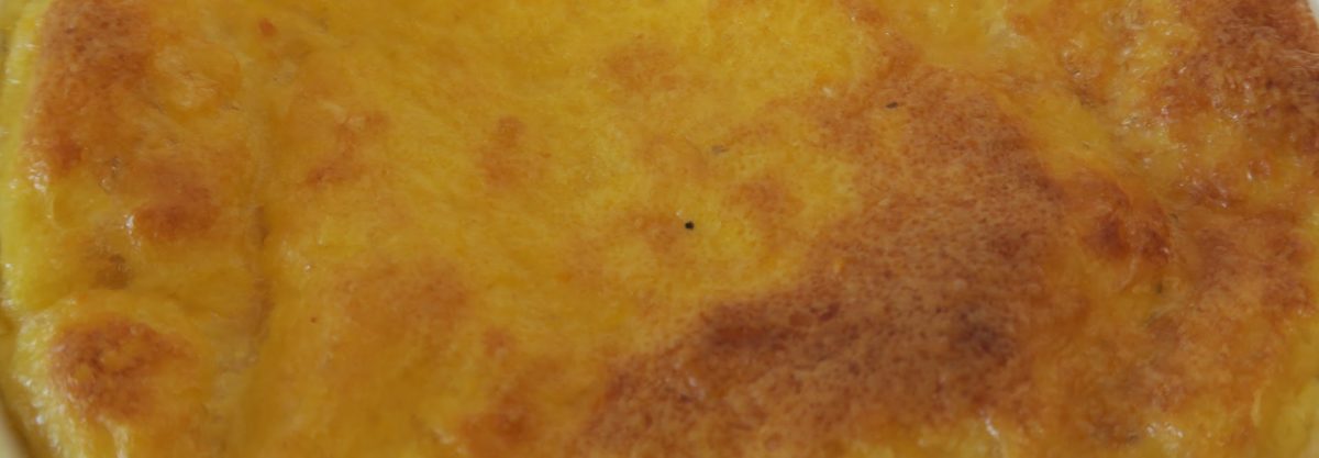 A close-up of the golden brown top of the finished Nachinka