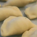 Pyrohy-Varenyky dumplings lined up in neat rows