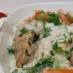 Chicken, potatoes and carrots covered in a cream sauce with dill and green onions