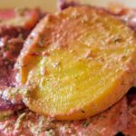 Yellow and red beets covered in a herb sauce